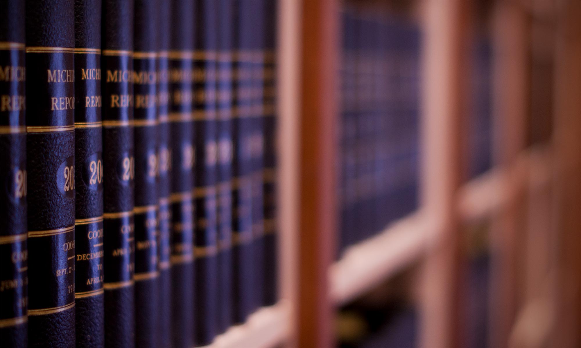 Background image of law books on a shelf